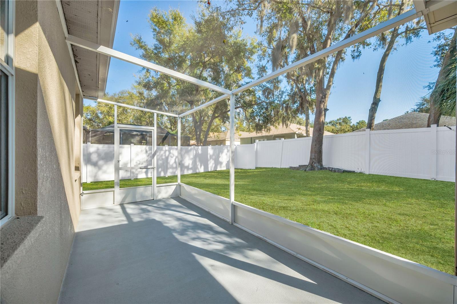 A small extension to the patio is not under the roof and lets the sunshine through the screen.