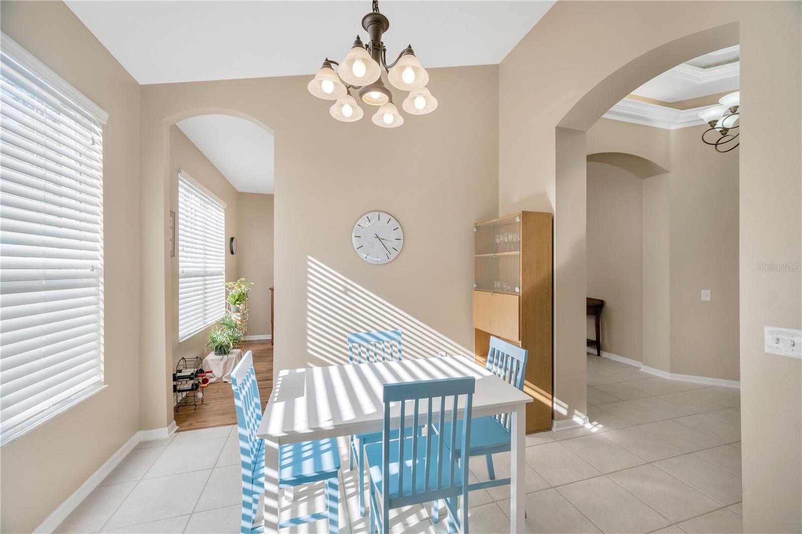 The kitchen has a large eat-in area and convenient access to the formal dining room.
