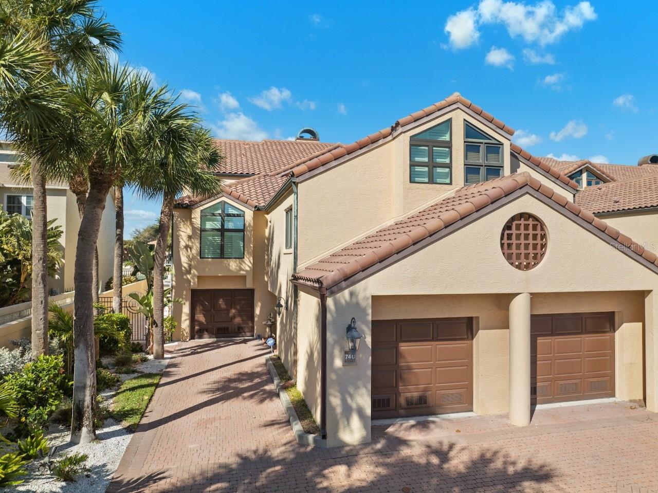Exquisite corner unit waterfront townhome with two oversized attached garages in Tierra Verde Florida!