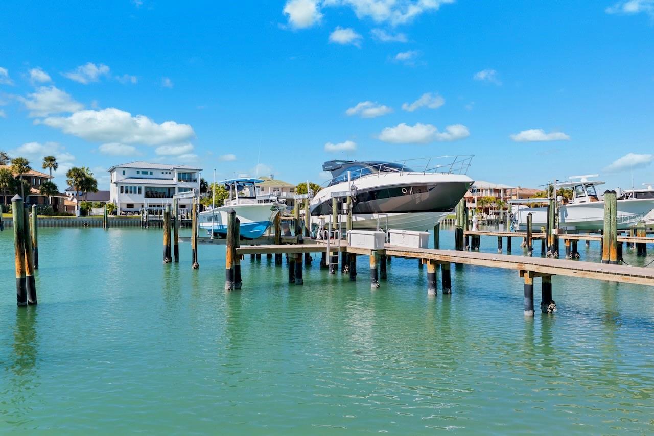 Large deeded boat slip with lift.