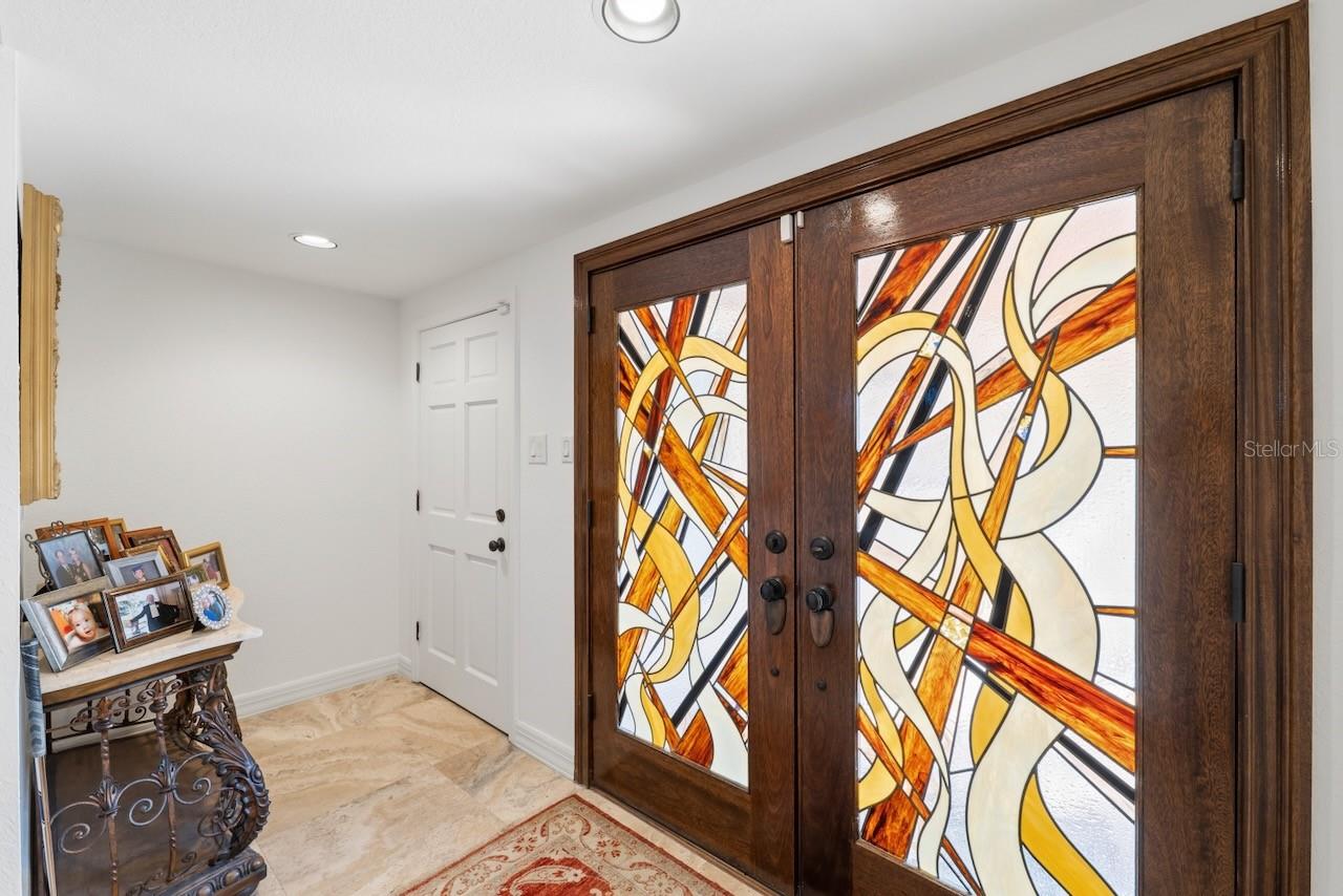 Exquisite foyer with leaded double glass entry.