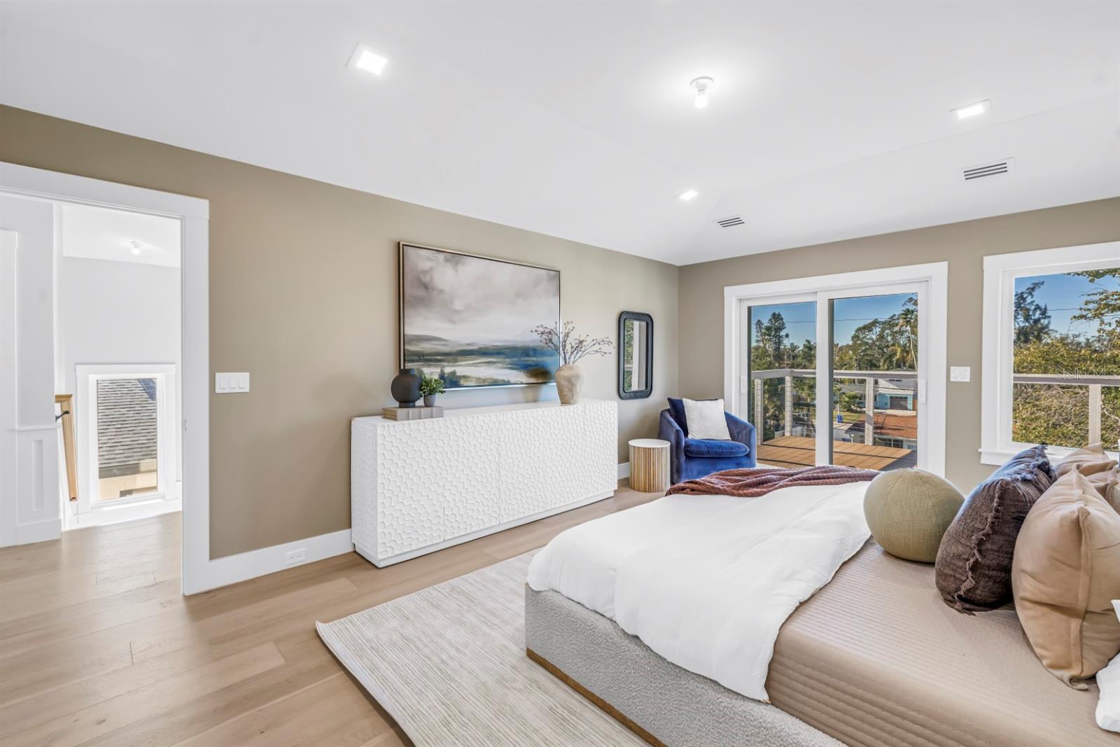 Sliders Capture Natural Light and Lead to a Private Owner's Balcony