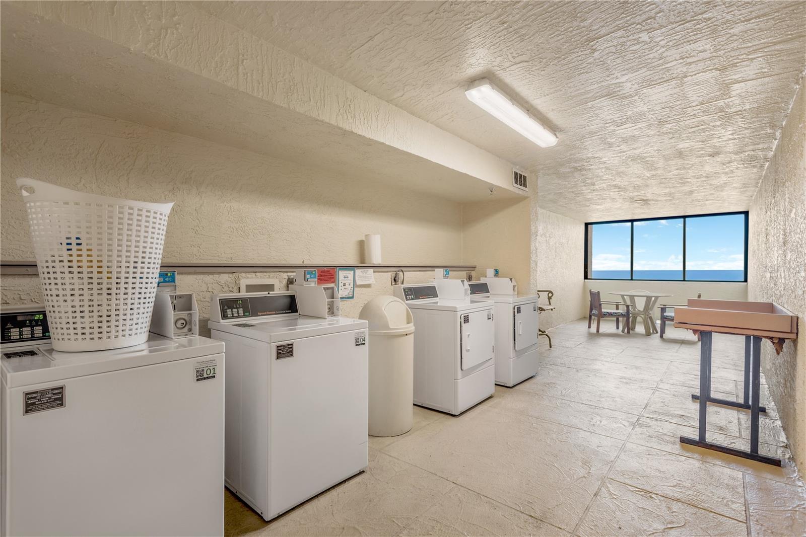Common laundry area is just a few steps down hall across from elevators.
