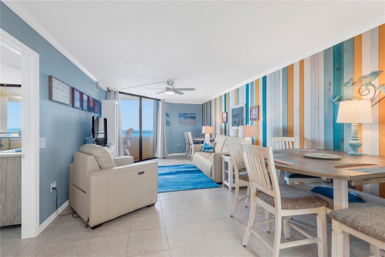 Easy care tile flooring, coastal accent colors and comfortable, stylish furniture pull the entire look together which is sure to impress.