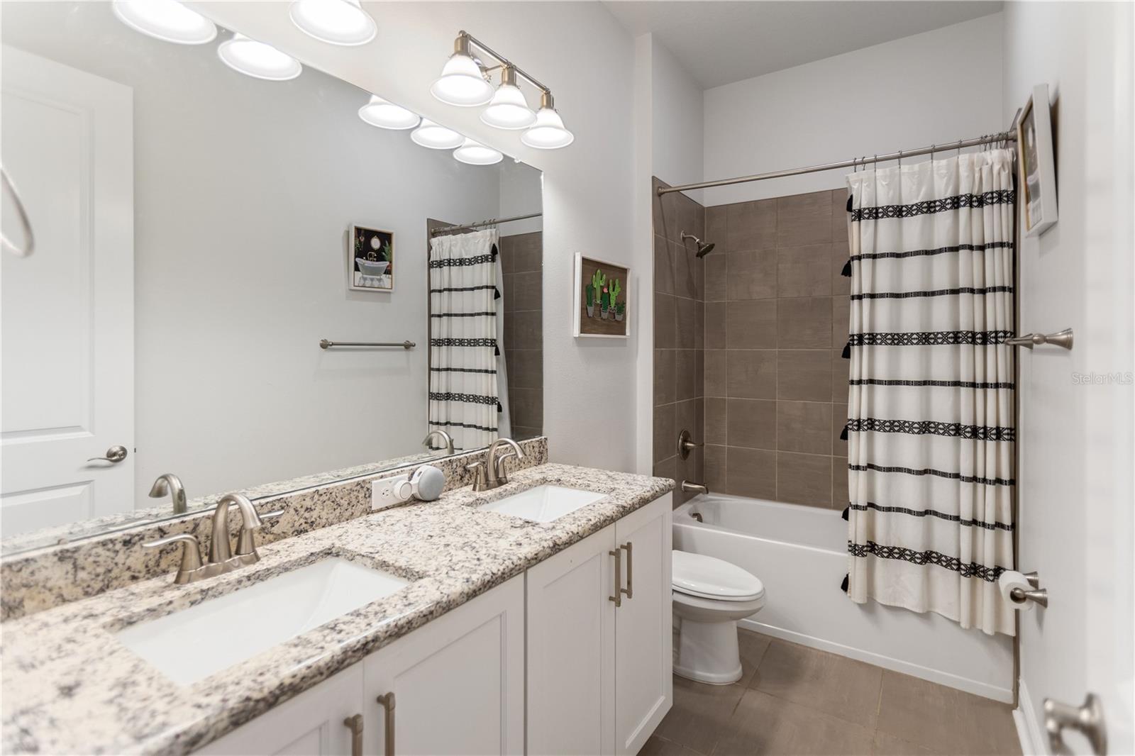 shared bathroom for bedroom on right wing