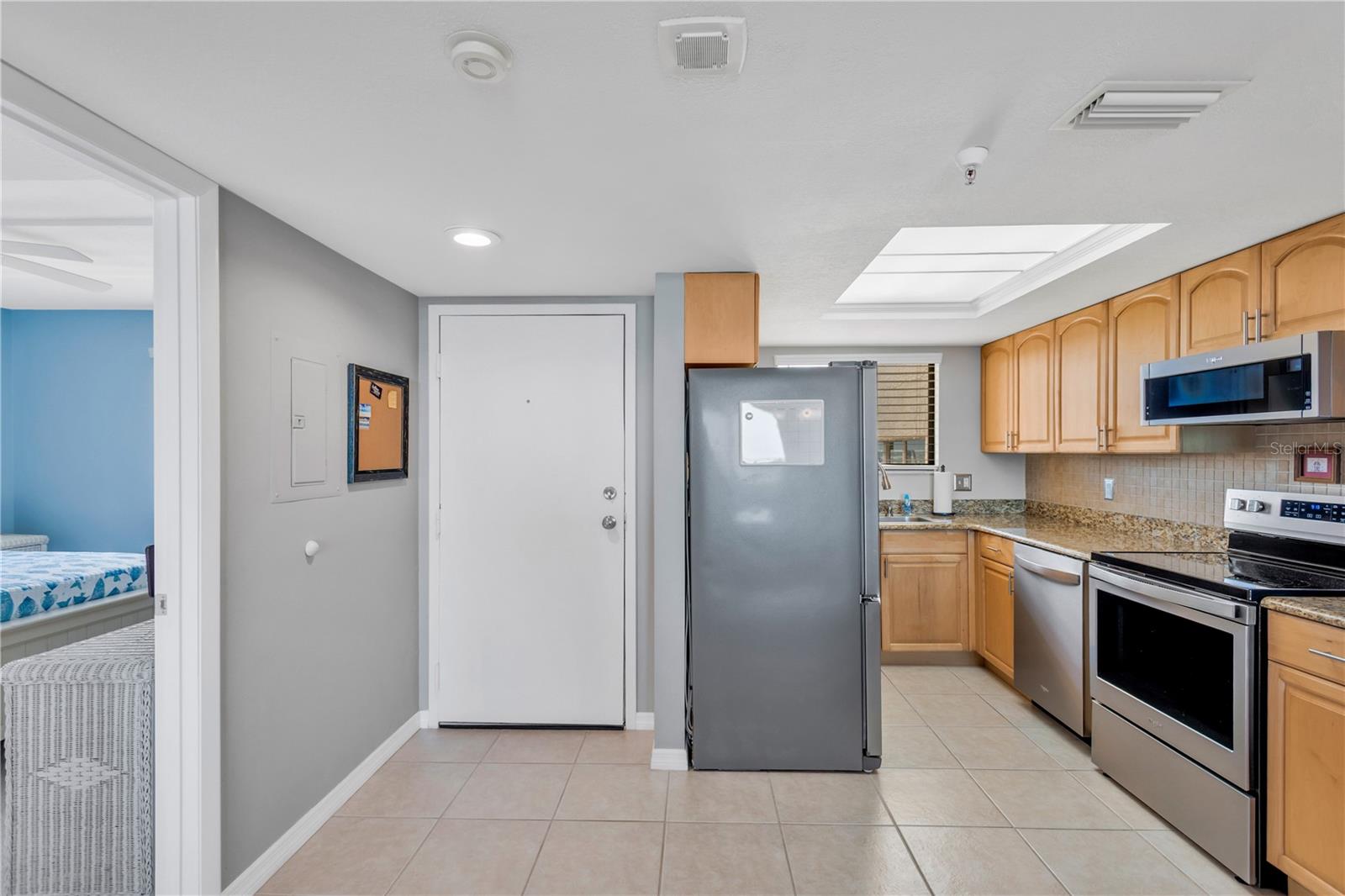 Stepping inside you will love this beautifully appointed kitchen with an abundance of cabinets, counter top space and stainless steel appliances; not to mention the easy care tile flooring throughout.