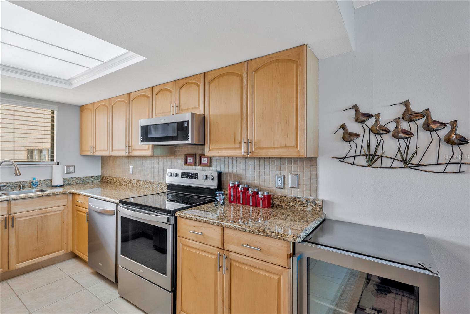 Another view of your sparkling kitchen.