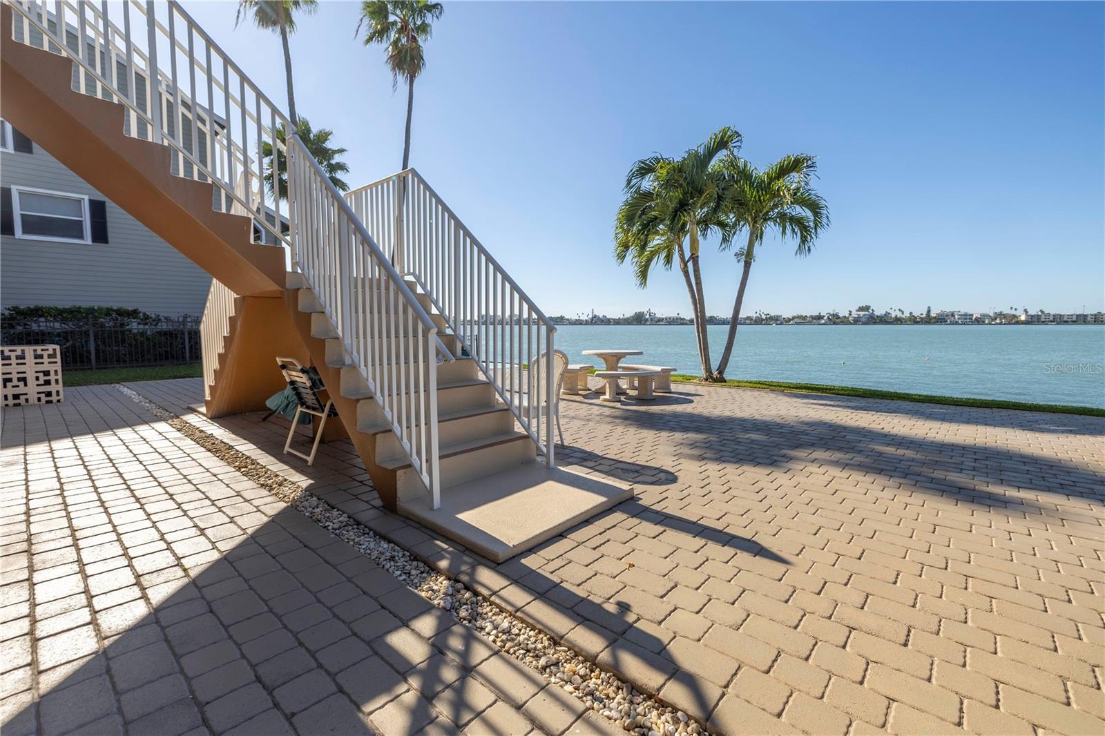 back paved patio leading out straight from the  Florida room