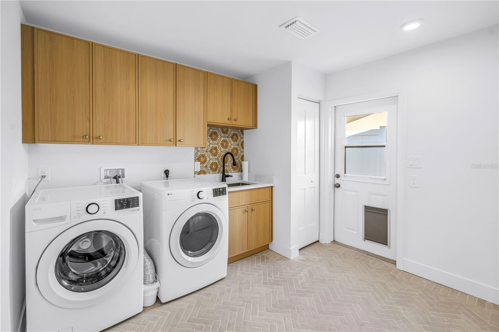 Laundry room with additional closet space and new 50 gal hw heater