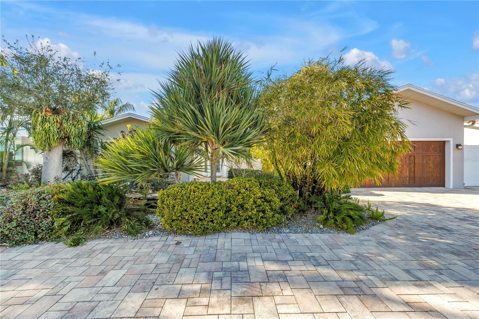 Front yard pavers and lush landscaping