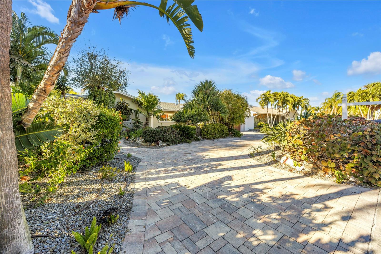 Front yard pavers and lush landscaping