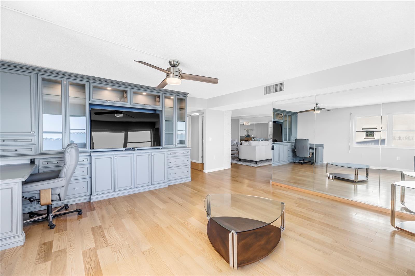 Bulit in desk with file cabinets. Monitor conveys