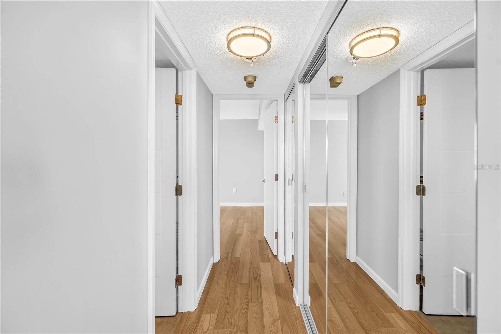 Hallway with muliple closests to the right