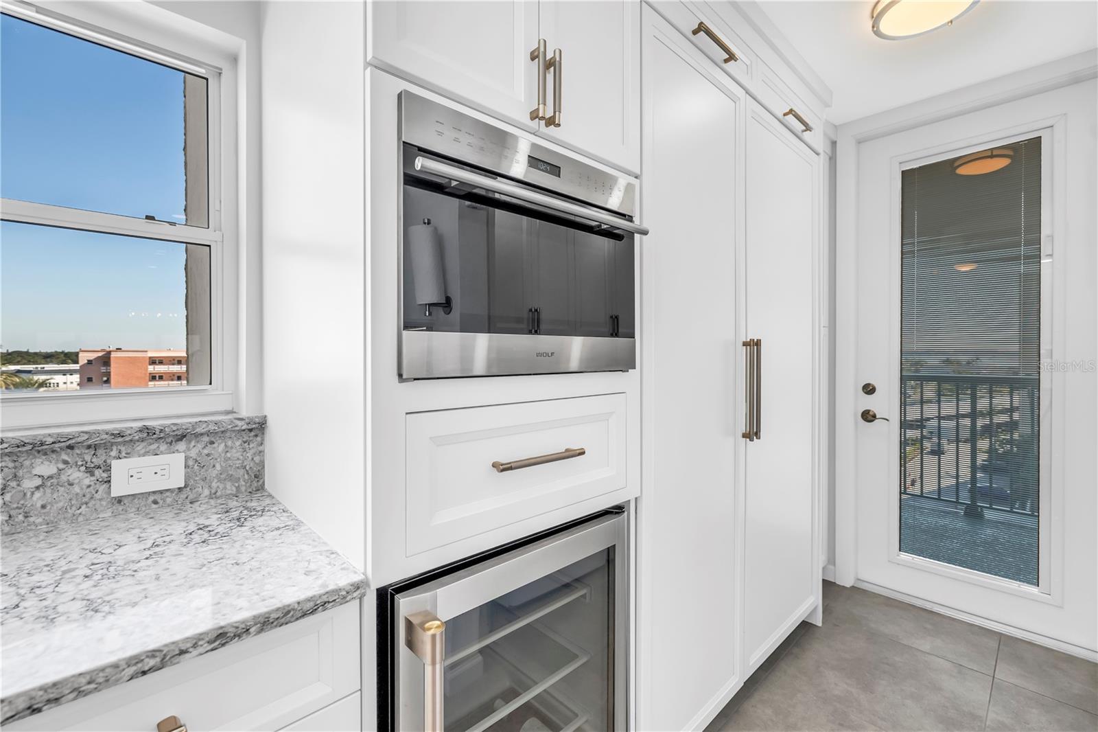 Convection over, wine refridgerator,storage and 2nd access door walking directly into the kitchen with provisions
