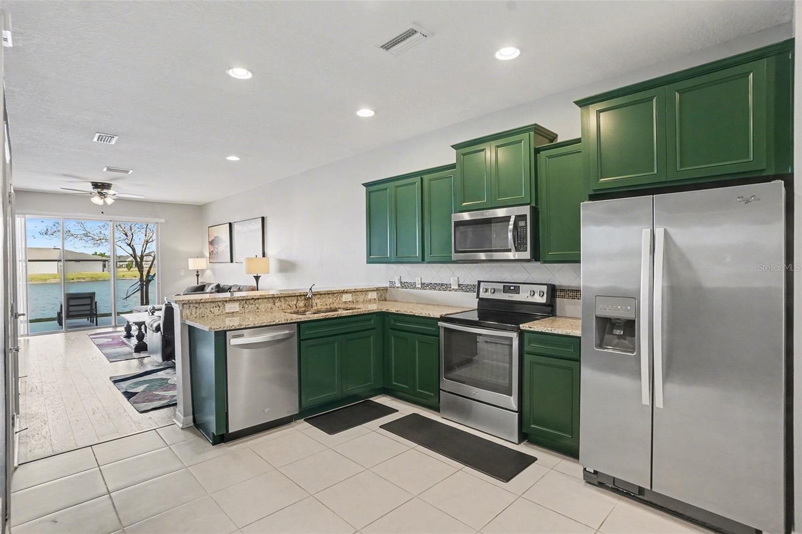 Kitchen with stainless steel appliances and granite counters