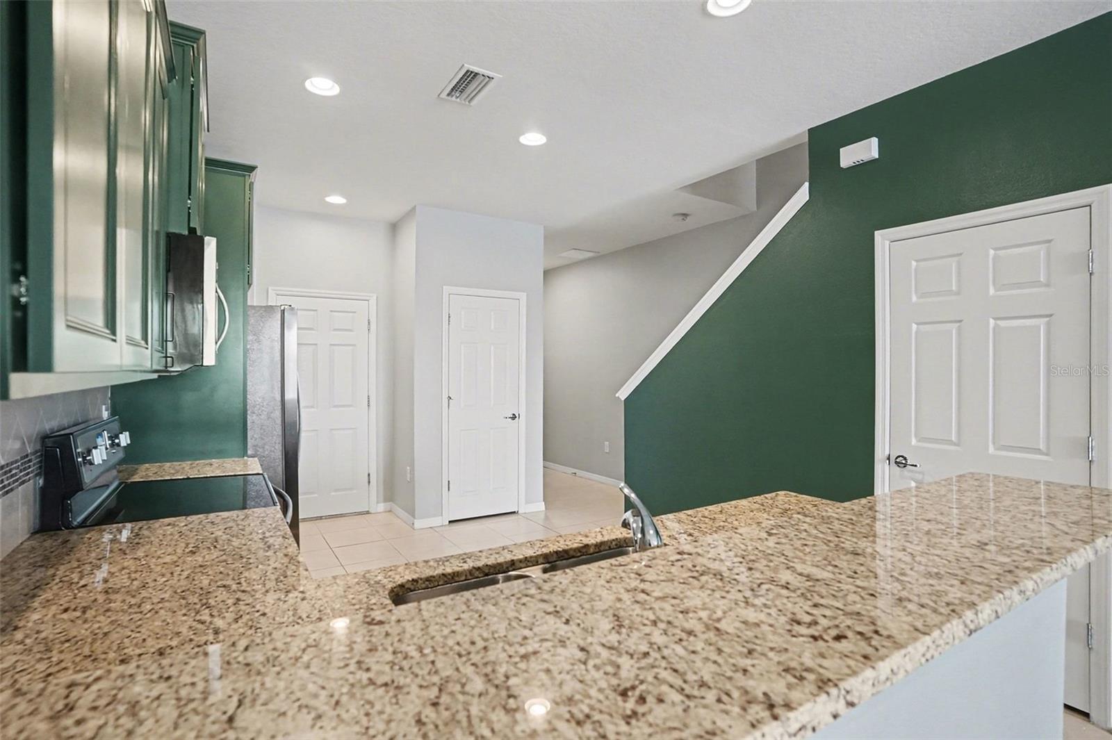 Kitchen with view of foyer