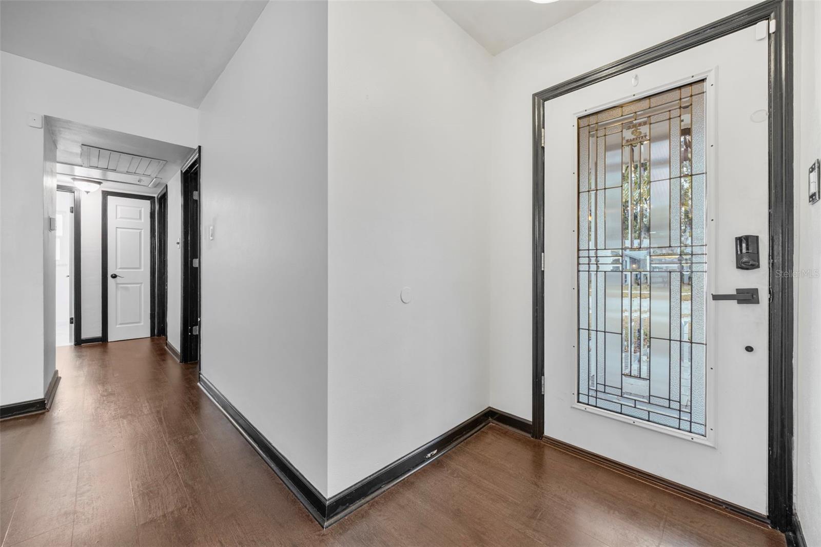 Front Door with Hallway Leading to Bedrooms