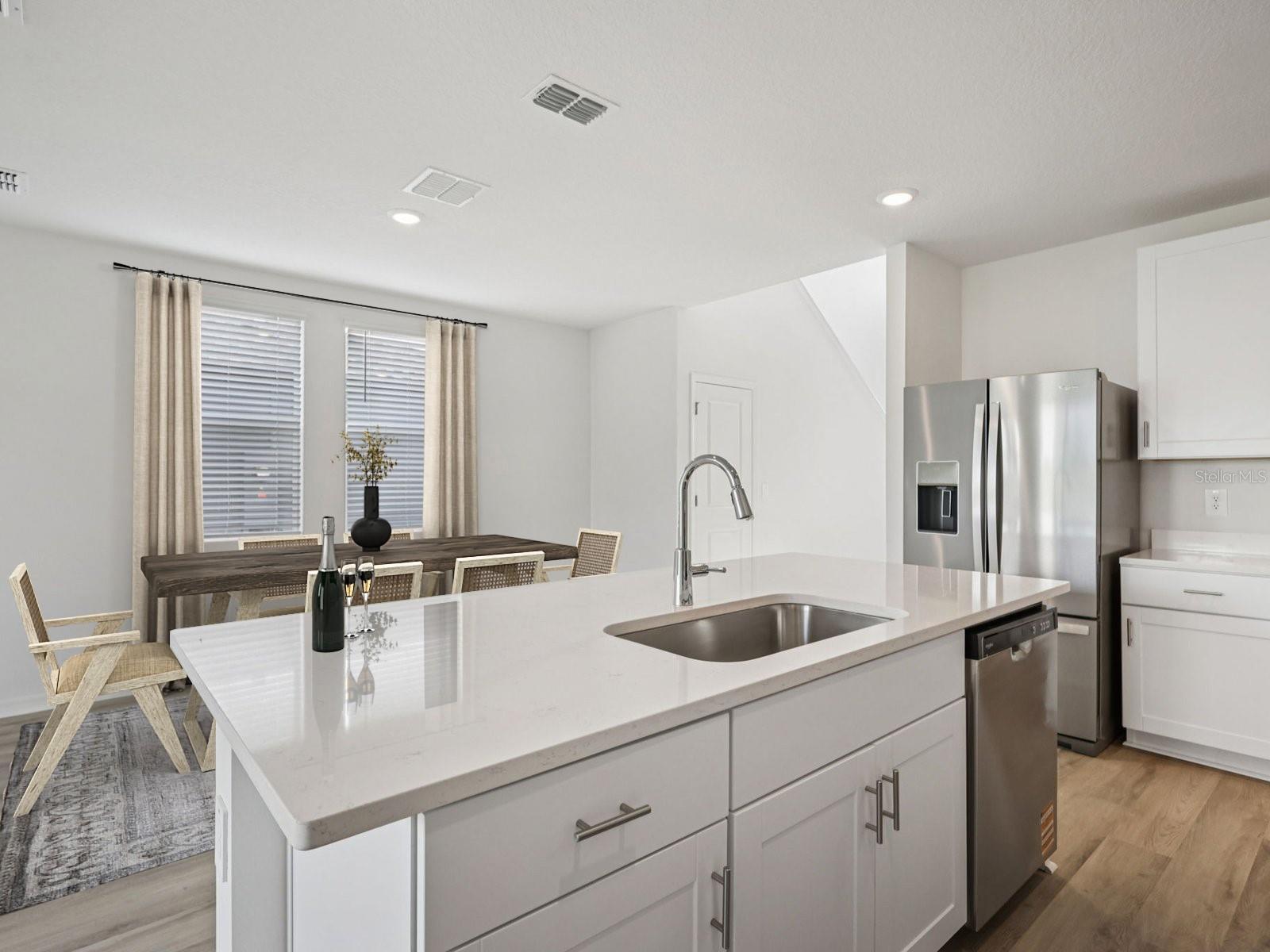 Interior photos are not of the actual home but are photos of the builder home with same floorplan with similar interior finishes and features. Photo uses virtual staging.