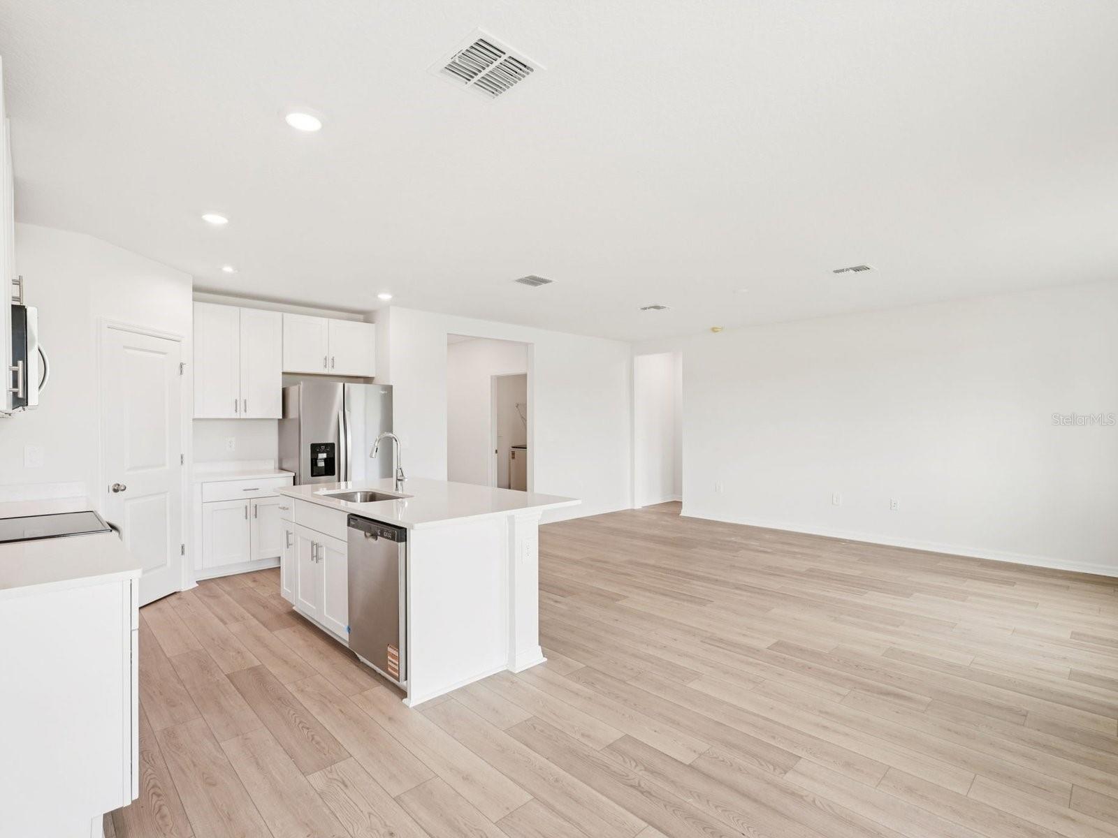 Photos are not of the actual home, but are photos of the builder home with same floorplan with similar interior finishes.