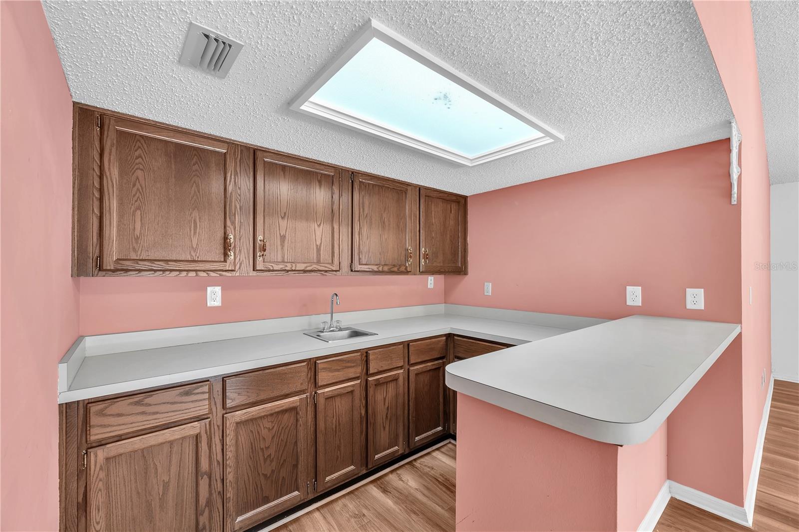 This wet bar and additional storage cabinets is an entertainers dream.