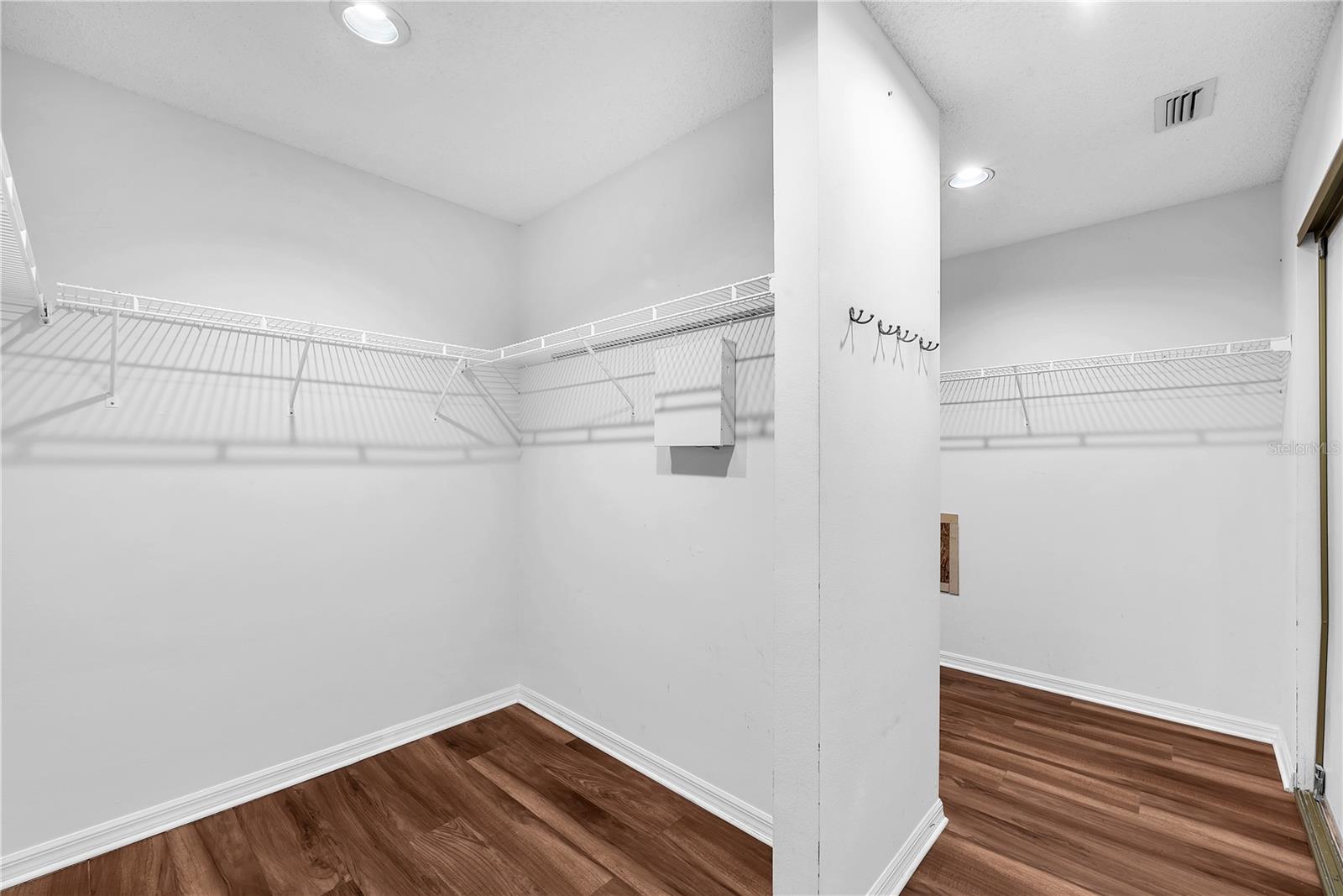 Another side view of Owner's closet and security system panel.