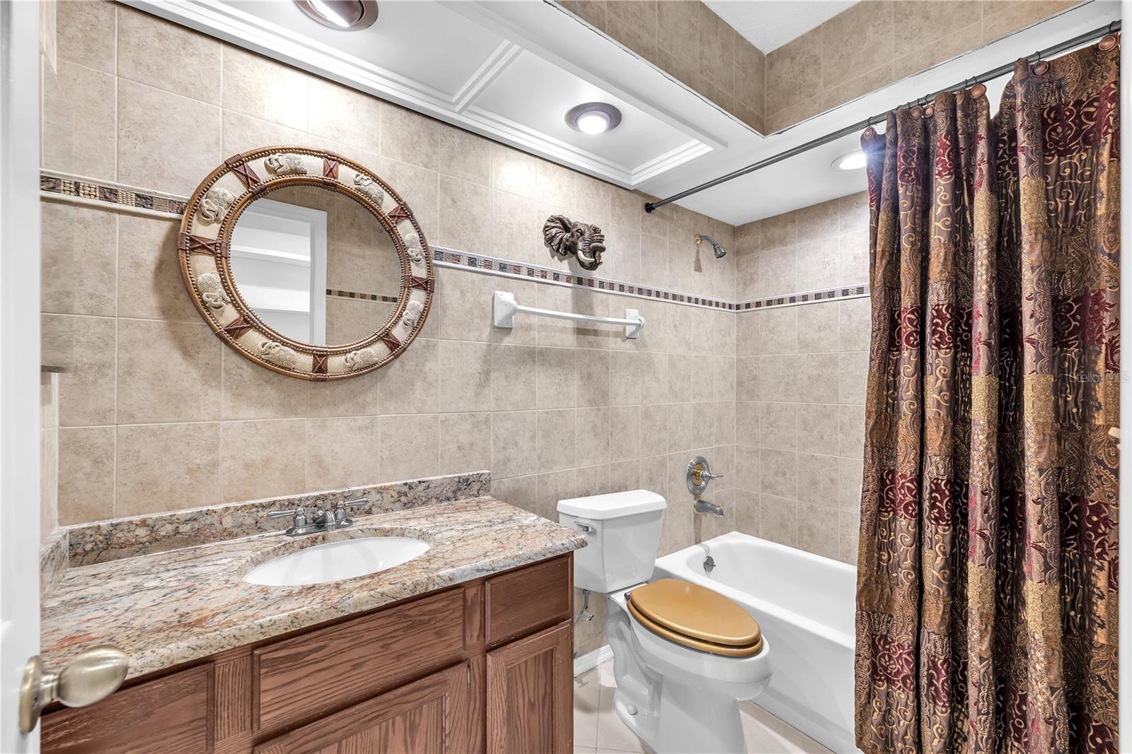 Shared bathroom with Tub/Shower combination in the guest wing.