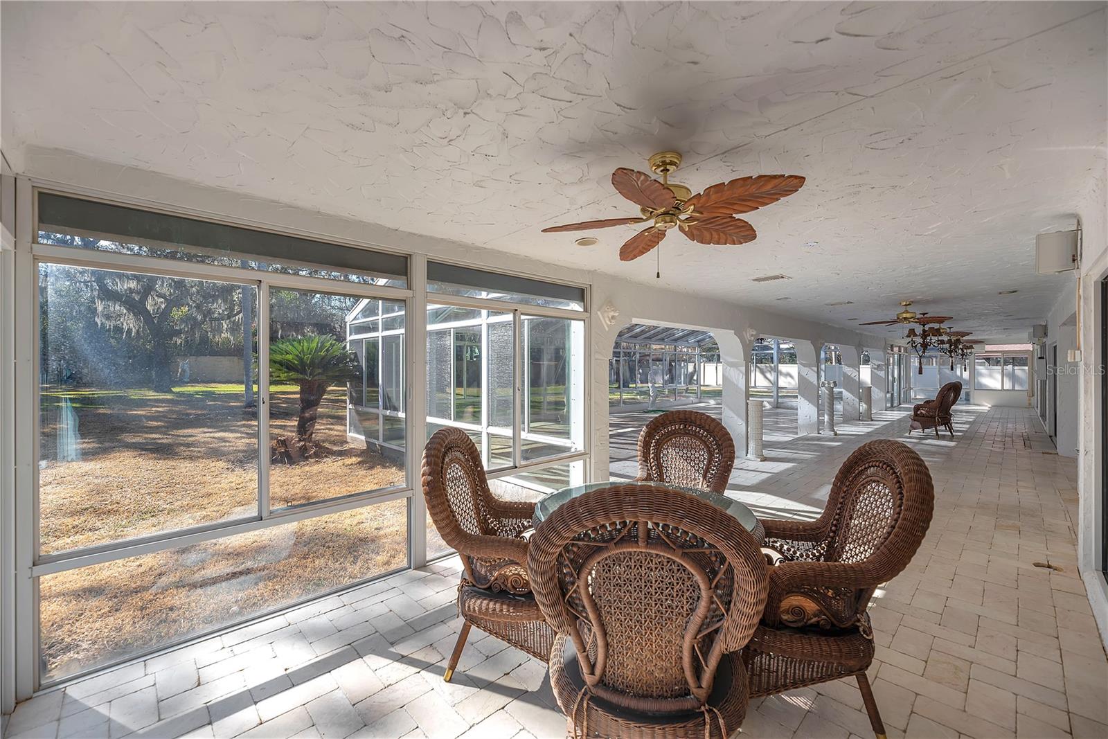 Enjoy the extra living space in this climate-controlled atrium with glass windows with screens, and three ductless mini-split AC units for year-round enjoyment.