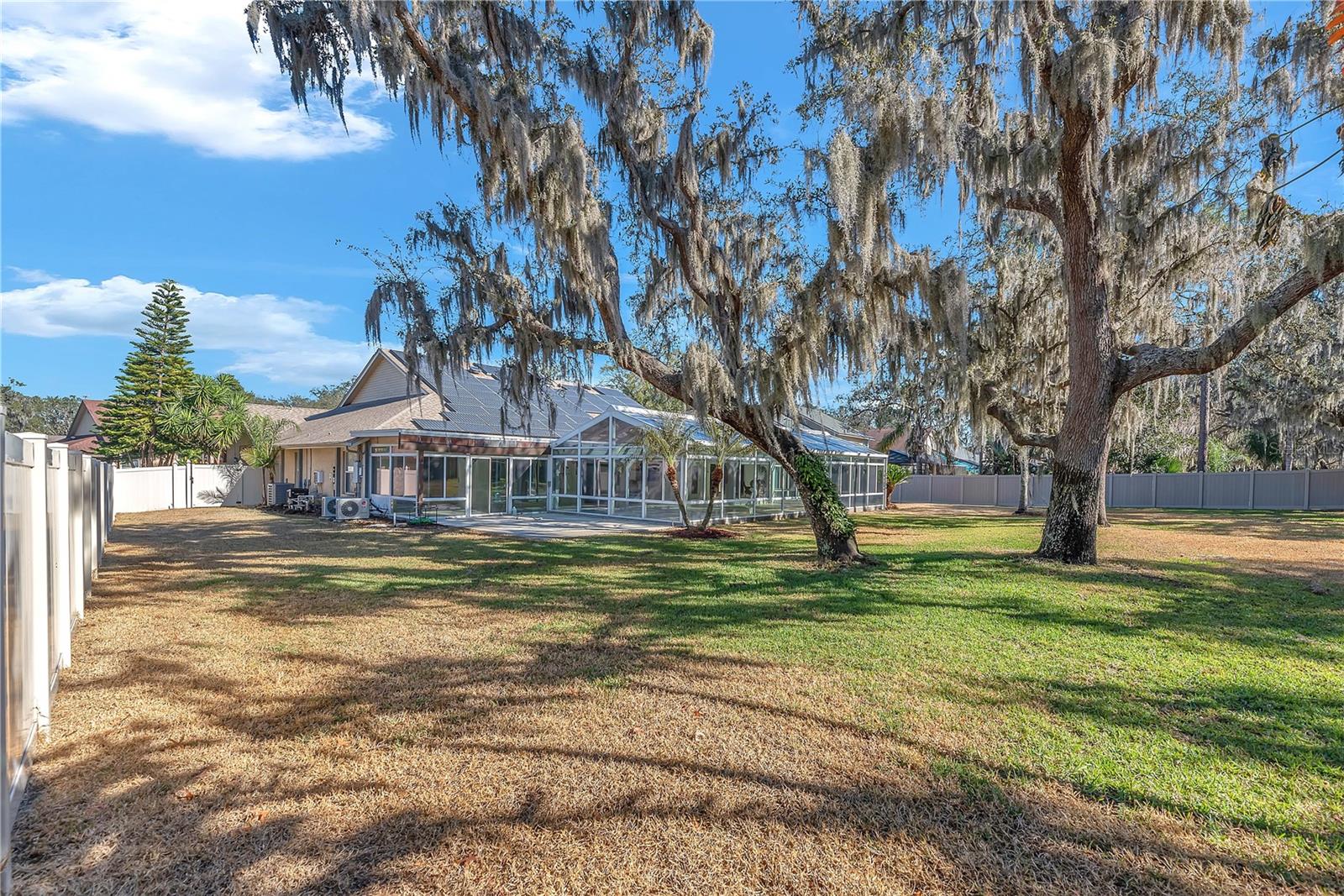 Mature Oak trees provide beauty and shade in this oversized fully fenced lot.