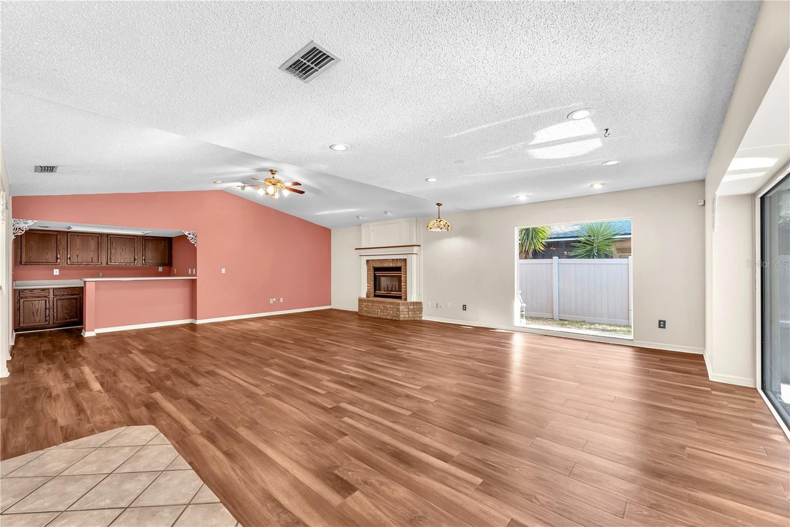 View of the family room and built-in wet bar from the kitchen nook.