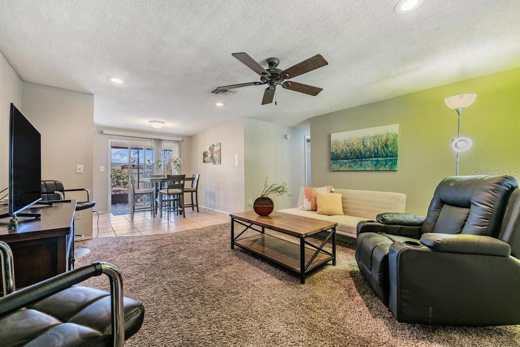 Family Room open to the Dinette area with Ceiling Fan