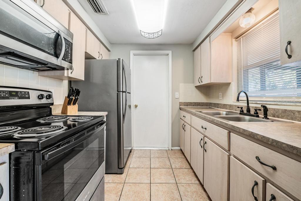 Kitchen with Stainless Steel appliances, and natural light.