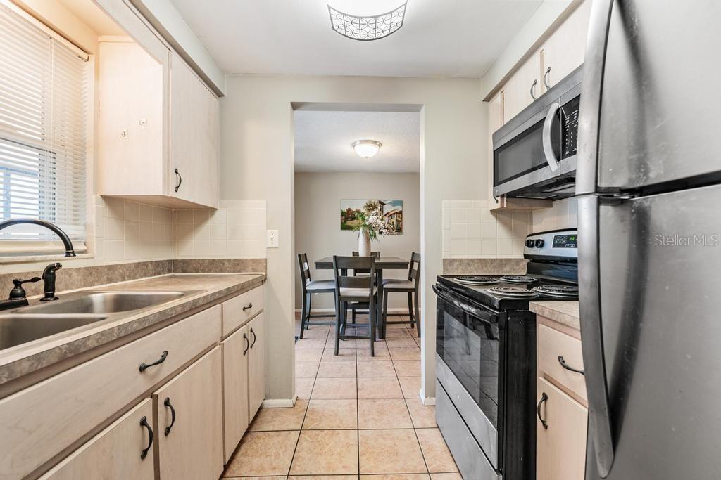Kitchen with Stainless Steel appliances, and natural light.