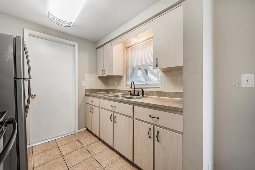Kitchen with Stainless Steel appliances, and natural light.