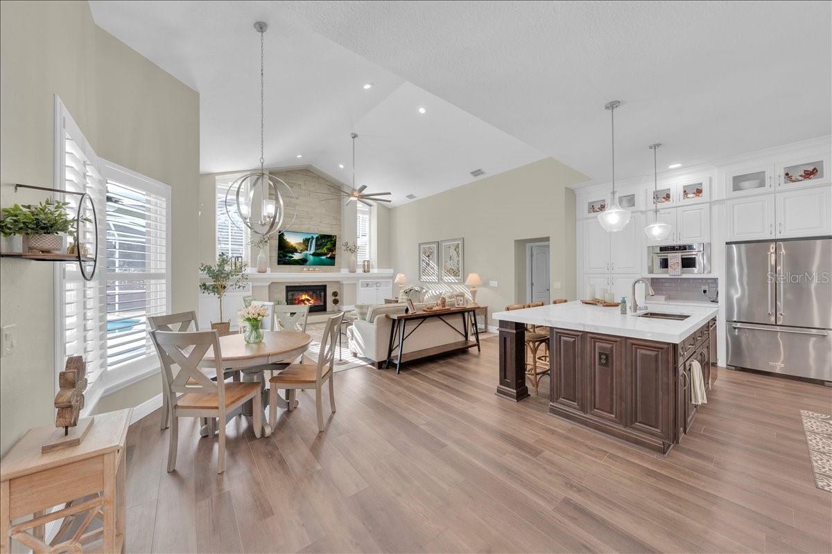 Updated kitchen is open to the family room that features vaulted ceilings!