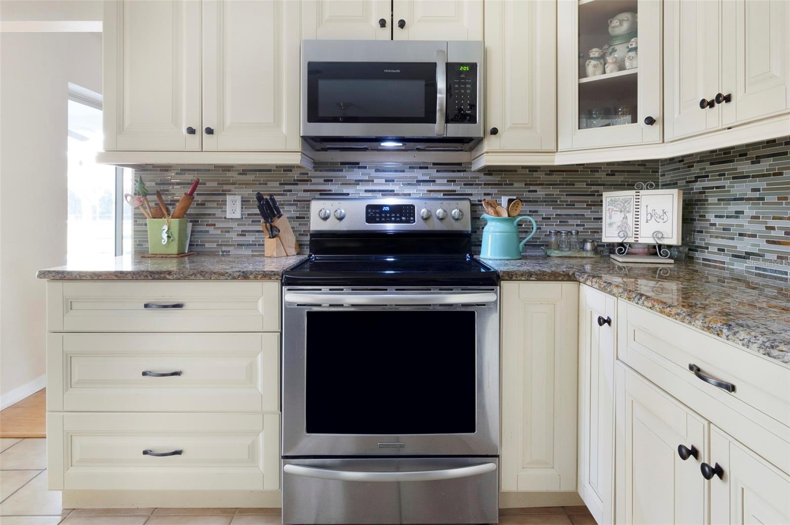 BEAUTIFUL KITCHEN WITH ALL STAINLESS STEEL APPLIANCES.