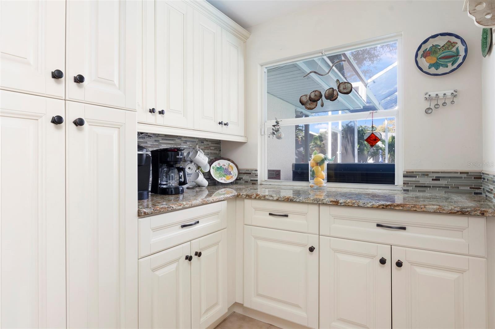 AMPLE EXTRA STORAGE WITH PASS THROUGH WINDOW TO POOL