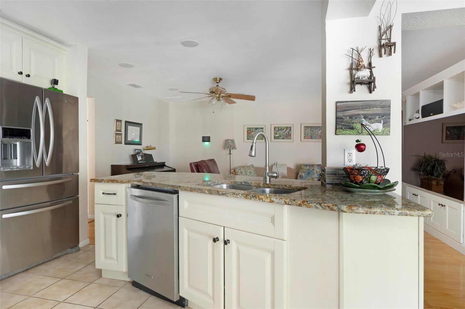 THE KITCHEN OPENS TO YOUR LARGE FAMILY ROOM.