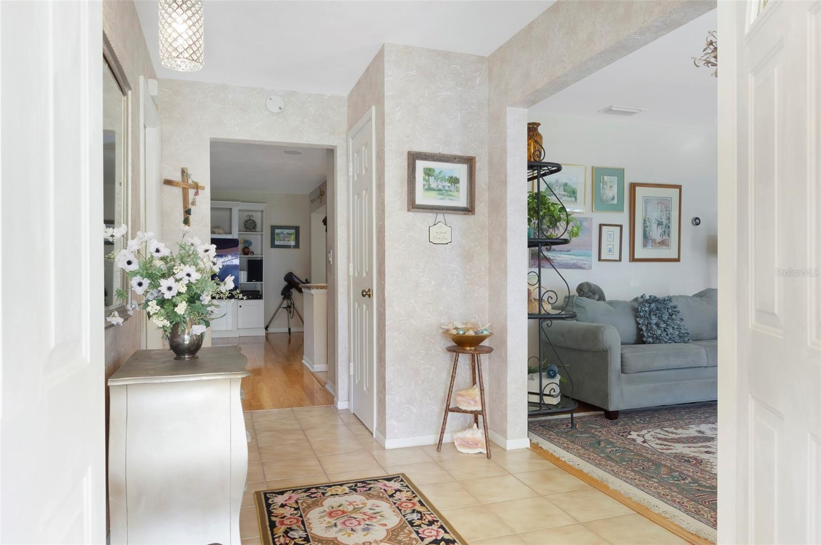 ENTERING THE HOME YOU WILL BE GREATED BY AN ELEGANT FOYER.