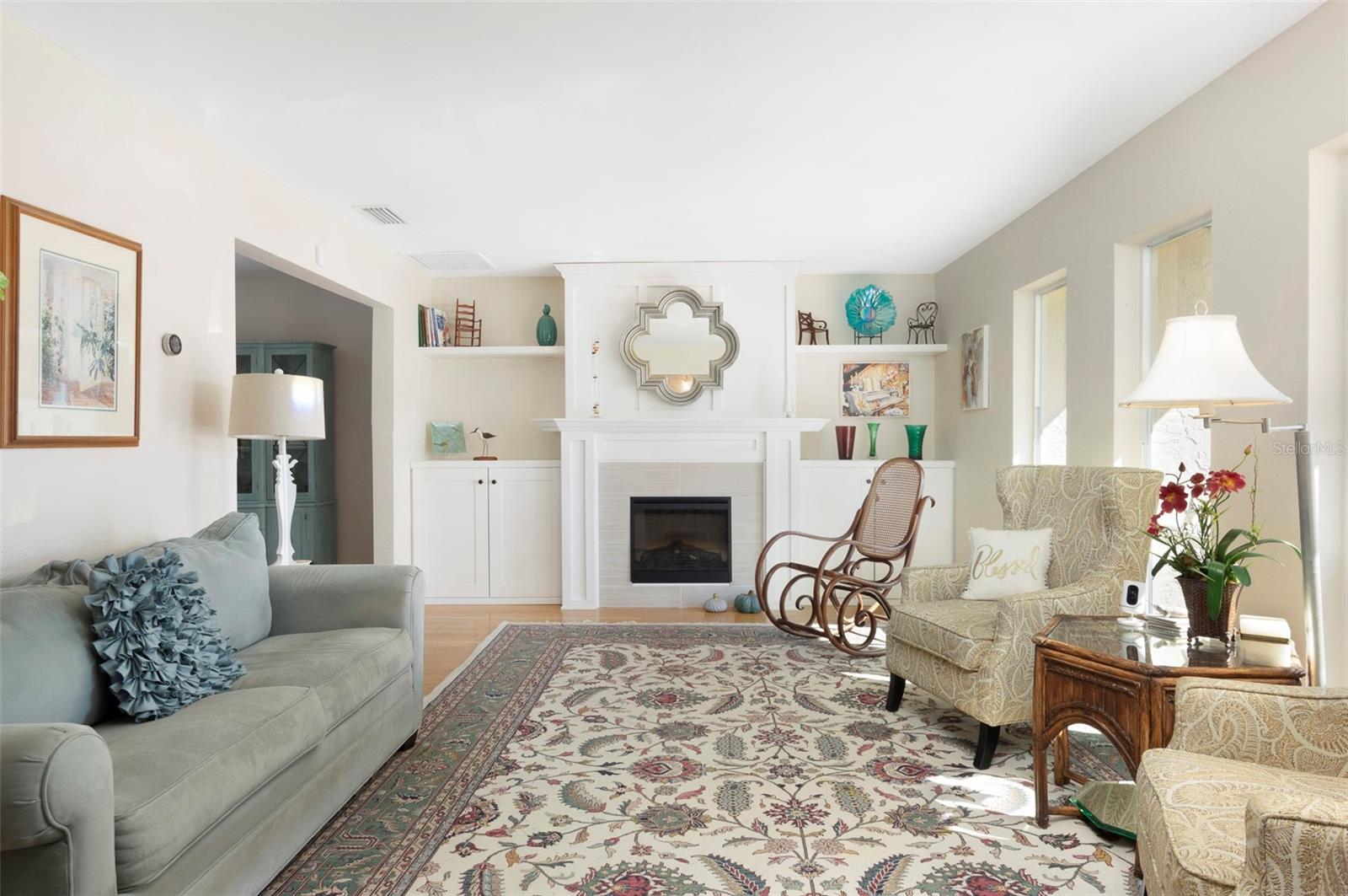 SPACIOUS LIVING ROOM WITH AN ABUNDANCE OF NATURAL LIGHT.
