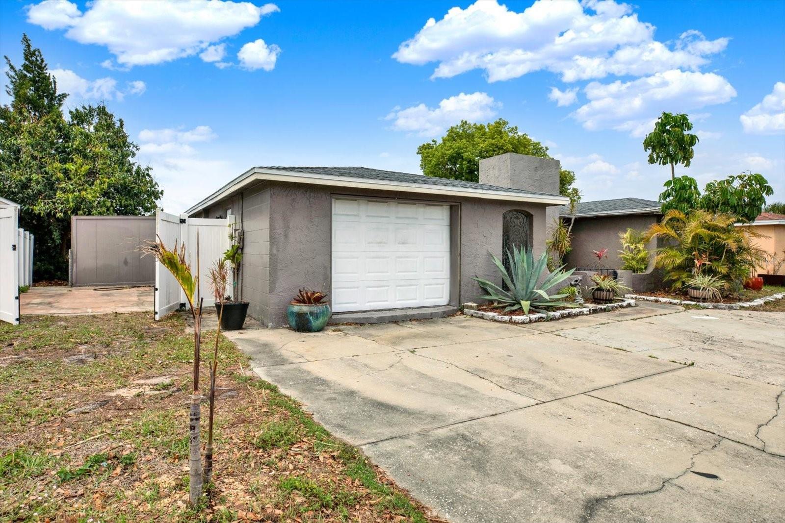 Private side parking pad and fenced property