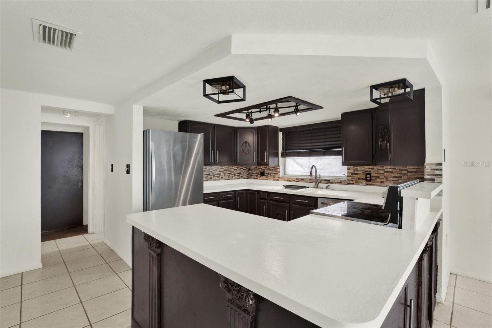 Pantry, garage entry, & Guest bath are to the far right