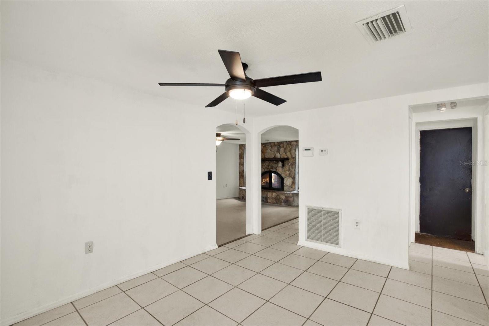 Arched doorways - view from dining area to the living/family room. Garage door is to your far right