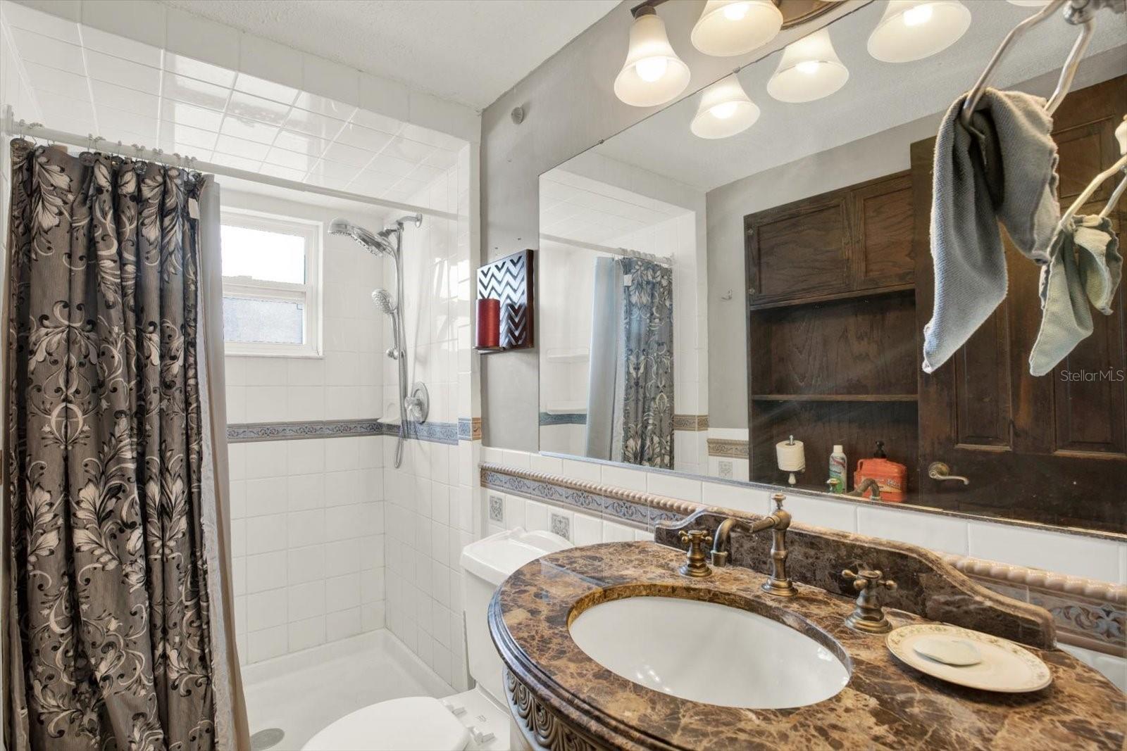 Guest Bath - located near kitchen