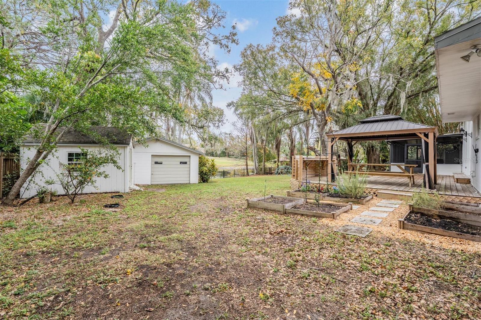 Gardening beds; gazebo and detached garage and shed