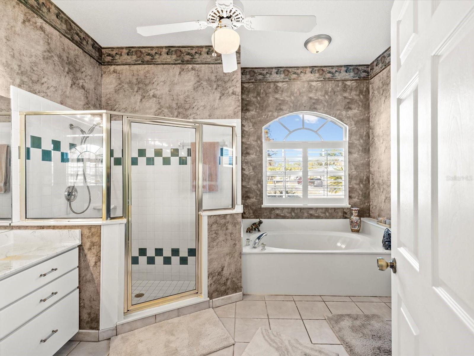 Owners ensuite with large walk-in tiled shower with bench