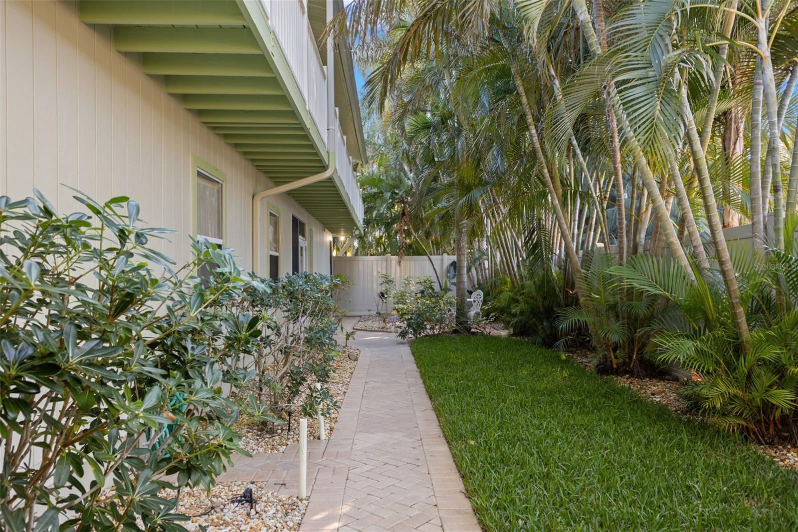 Walk way to front entry with lush landscaping