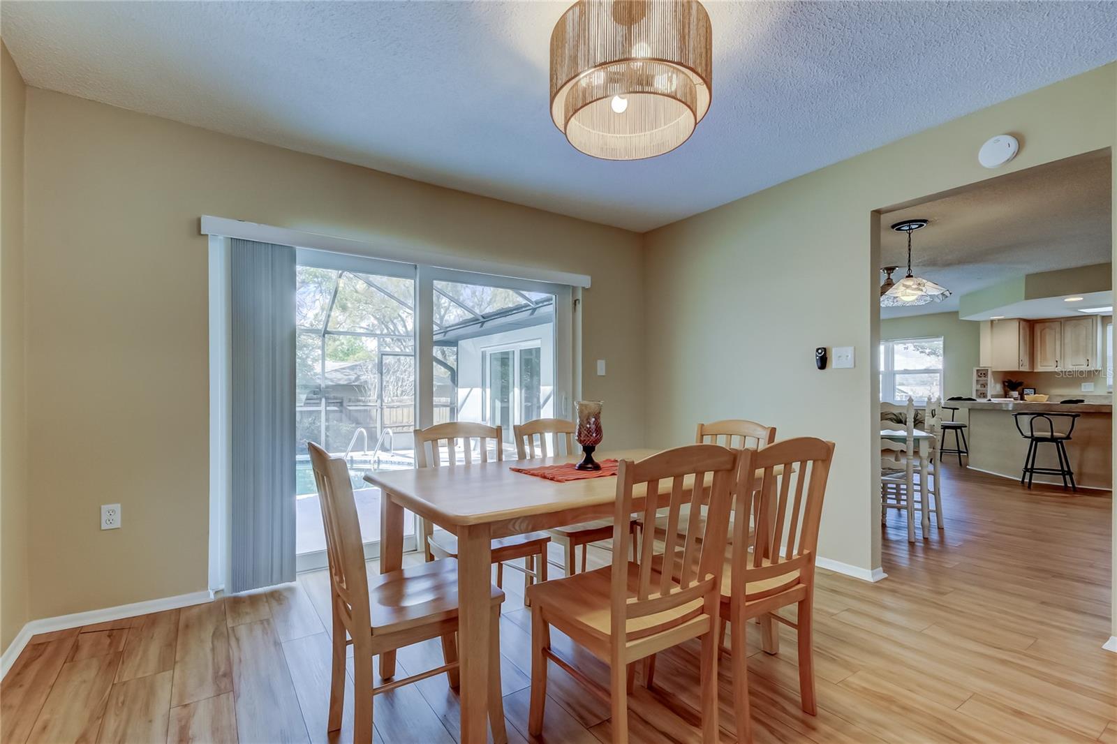 31. Dining Space (9.5' x 12.3') Great View of Pool & Backyard... New Coastal Rattan Lighting Fixture!!