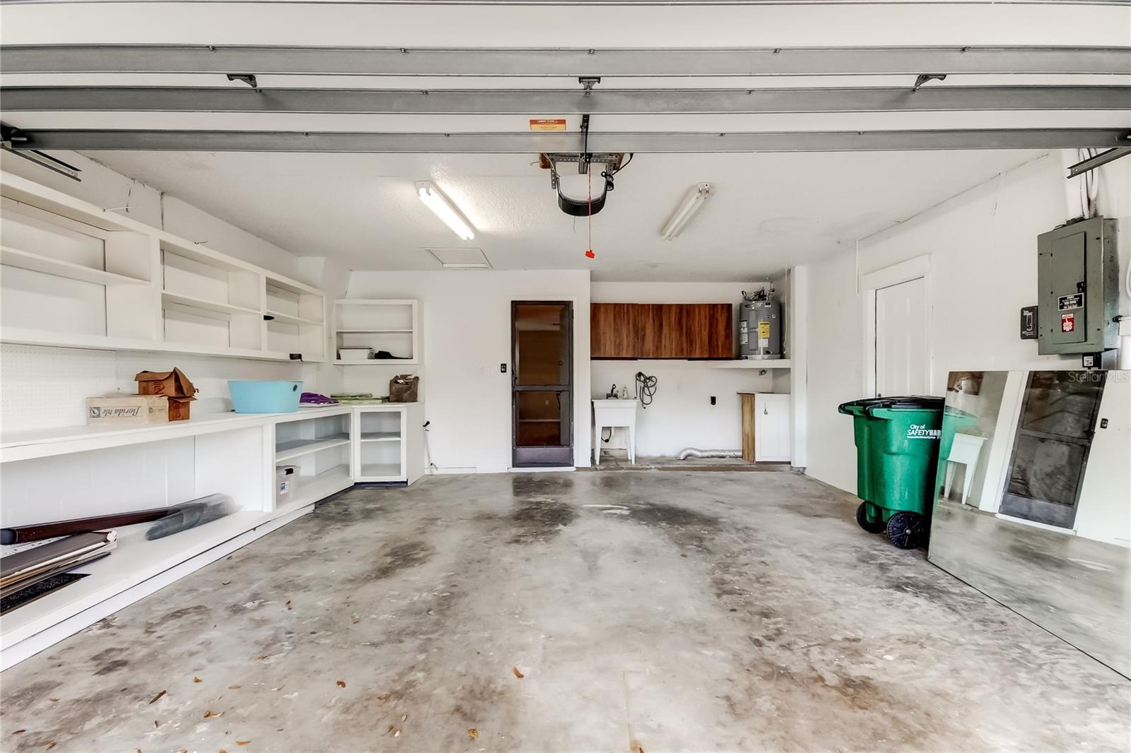 63. Spacious 2cg (19'x24') w Shelving Built In, New Door to Side Yard for Easy Garbage Can Storage & Access!