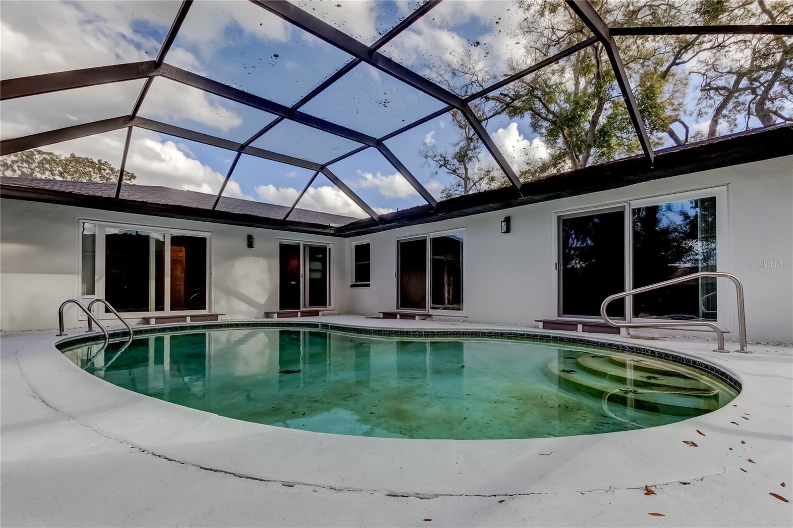 64. Rescreened Bird Cage, Painted Pool Surround, Newly Built Trex Steps, x4 Sliders into Lanai!!