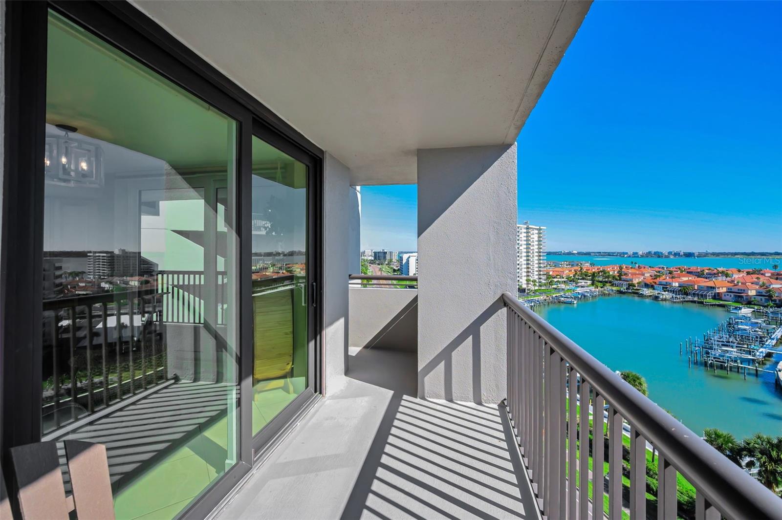 Step out onto the large waterfront balcony from the kitchen & dining area